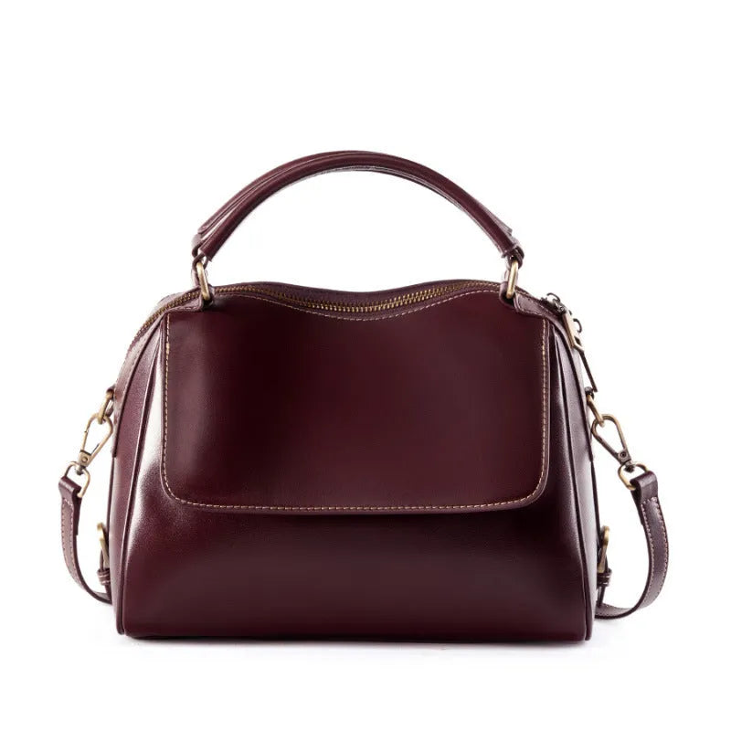 Women's soft genuine leather crossbody tote bag in apricot colour with slit pocket and double straps