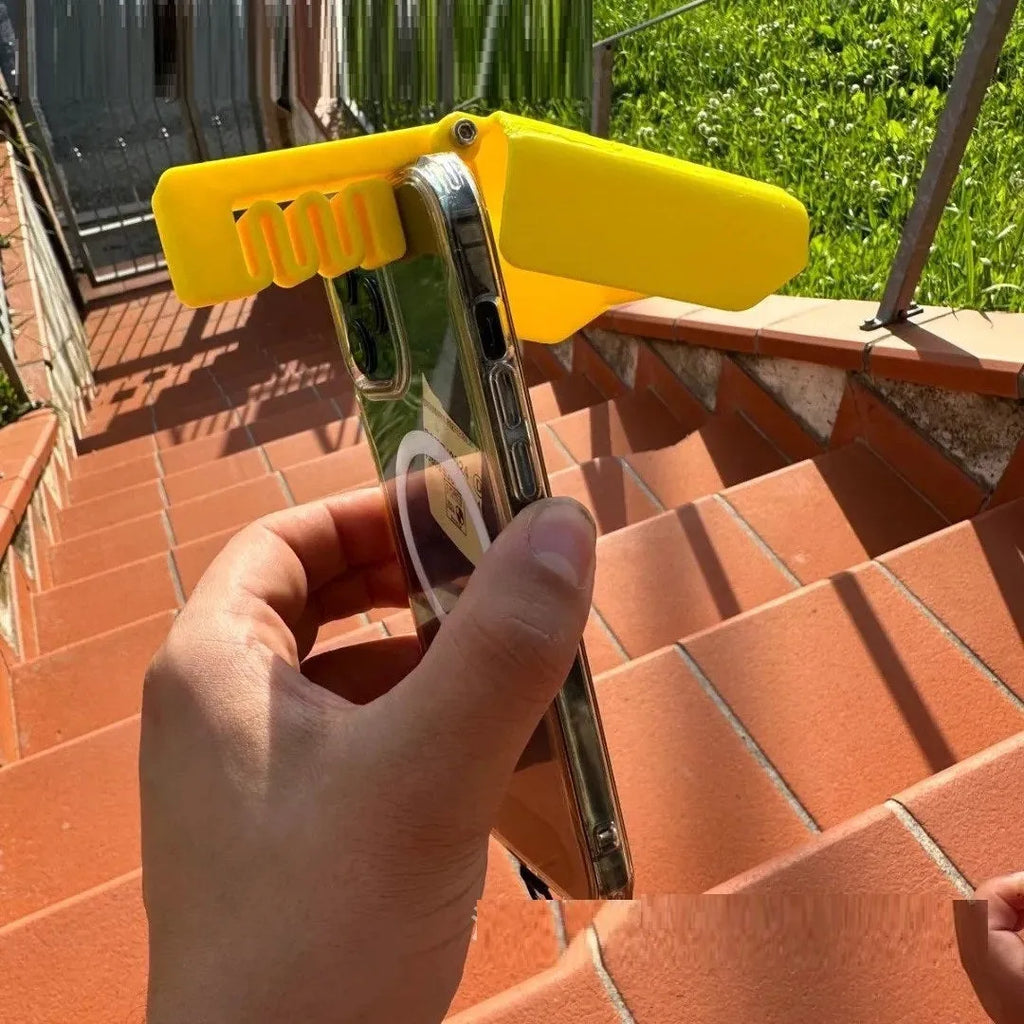 Yellow plastic beach pool phone sunshade holder clipped to mobile device