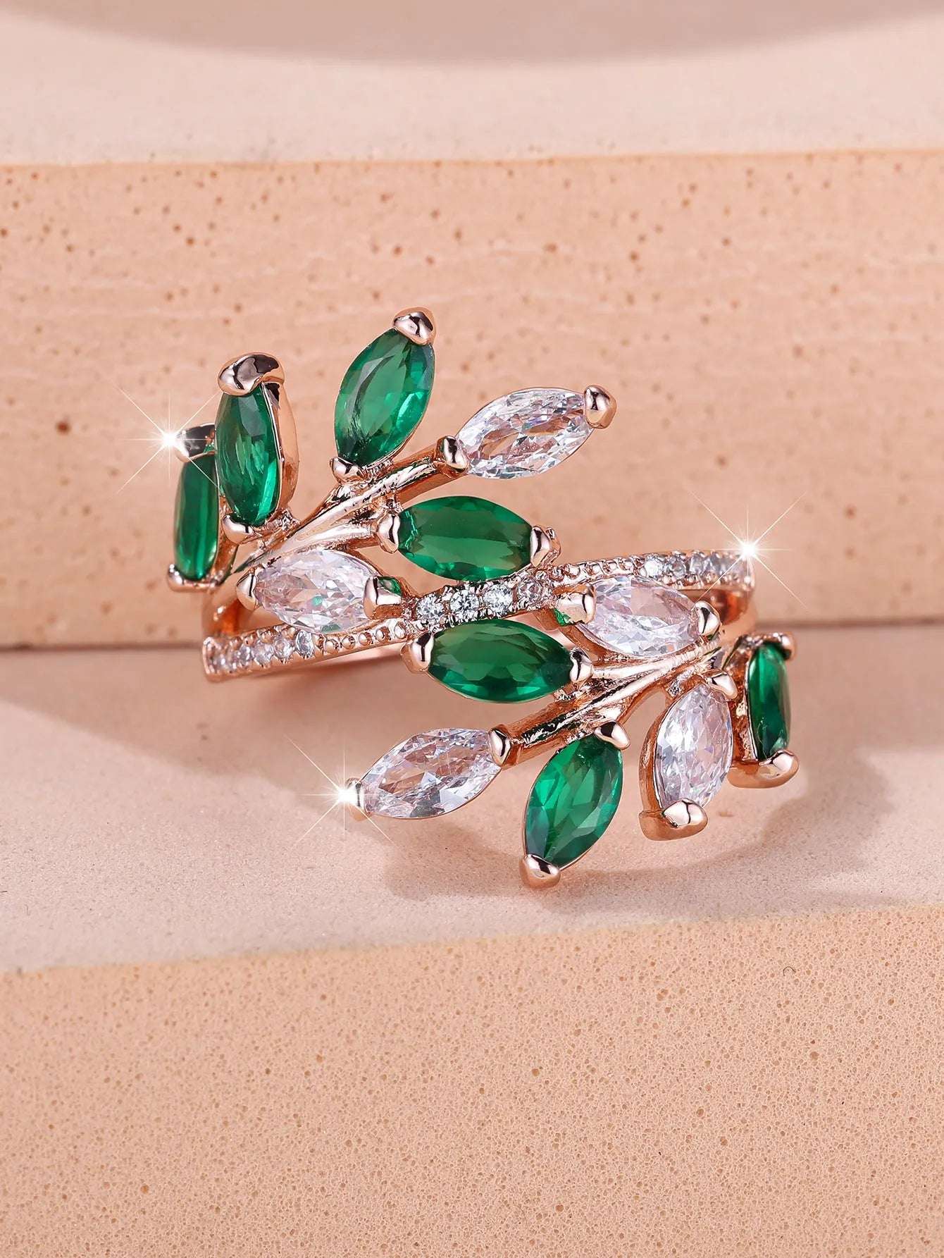 Adjustable copper leaf ring with horse eye zircon stones in multiple colour options showing botanical design
