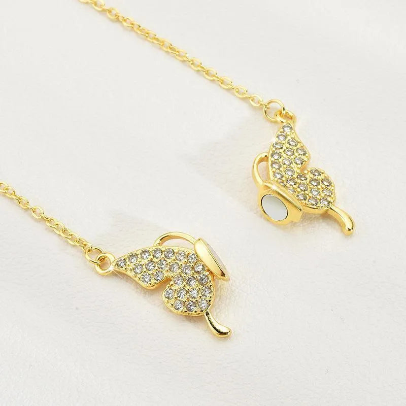 Gold magnetic snap butterfly necklace on twisted chain, adjustable 40-45cm length, titanium steel construction
