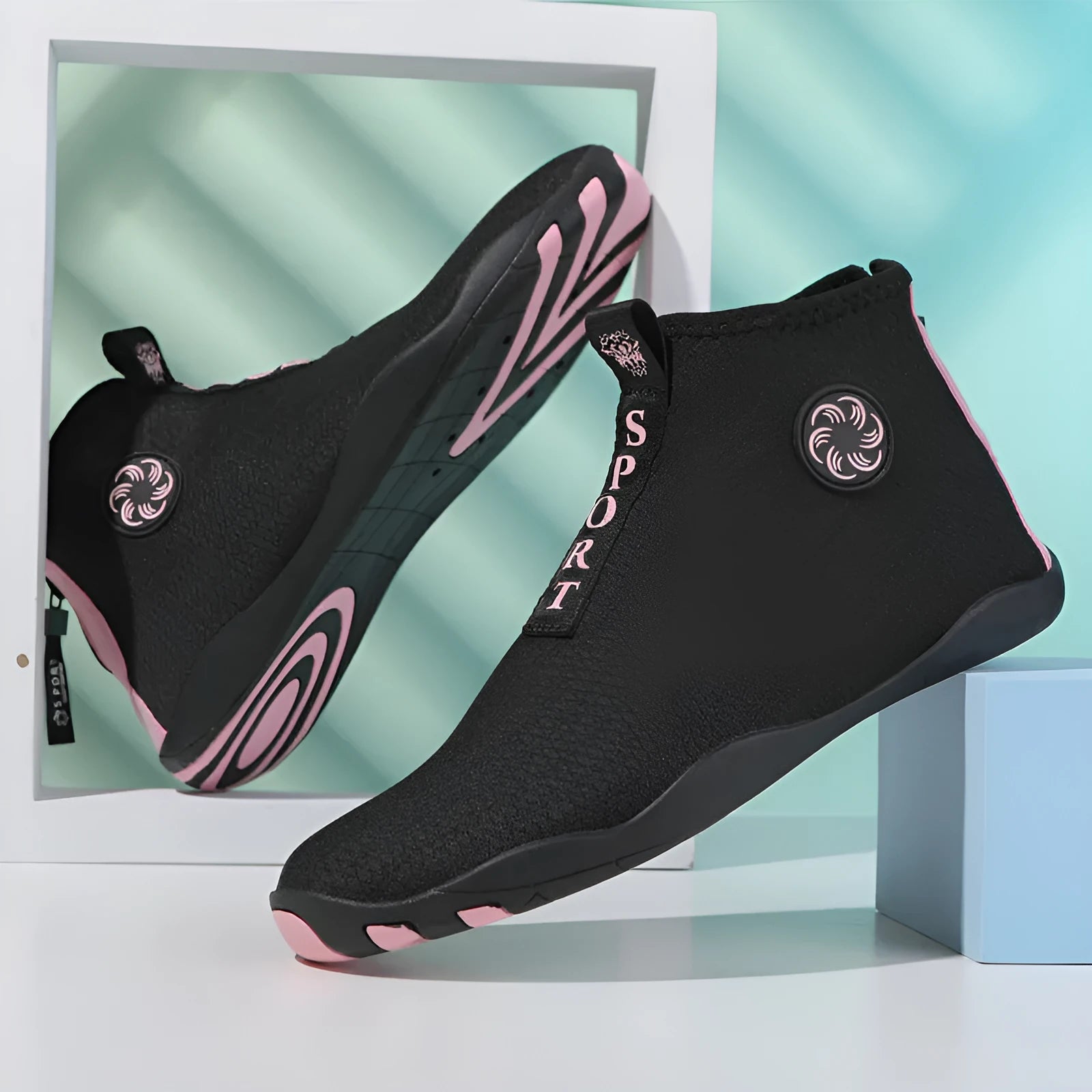 Outdoor beach shoes in black and fluorescent green with mesh upper and rubber sole.
