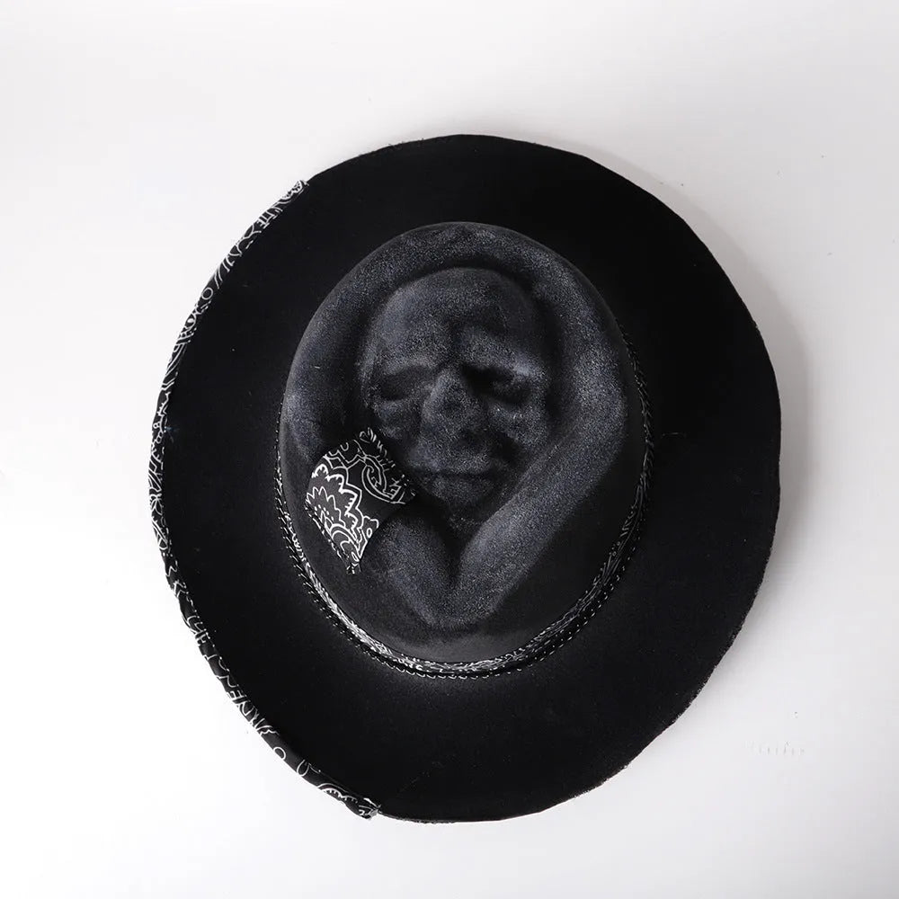 Handmade wool felt skull hat with conical crown showing integrated skull pattern design