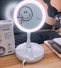 White acrylic double-sided LED vanity mirror with 360-degree rotation and USB charging cable