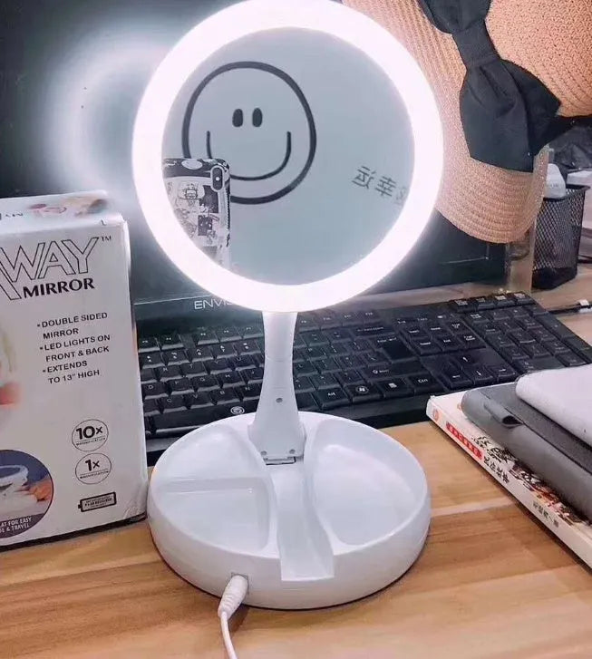 White acrylic double-sided LED vanity mirror with 360-degree rotation and USB charging cable