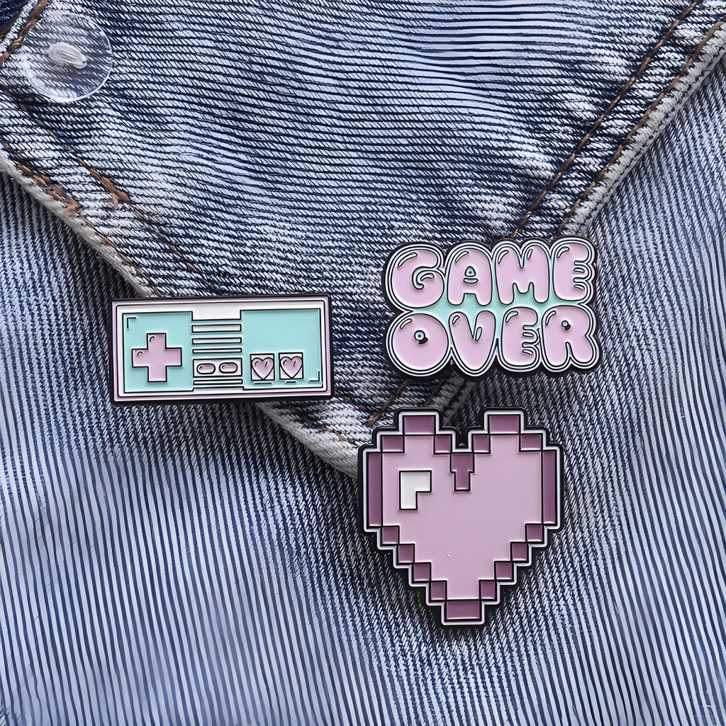 Three-dimensional alloy game console badge in metallic finish with mounting points