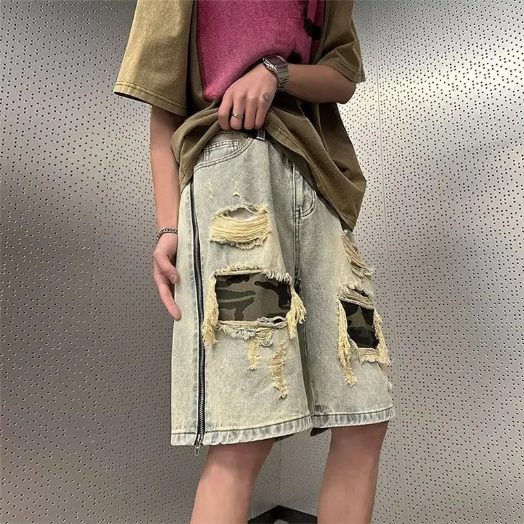 Men's yellow mud camouflage ripped denim shorts in a straight-leg style