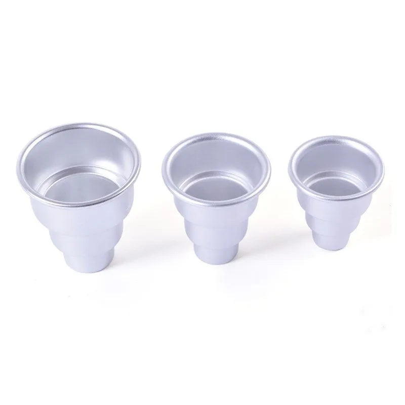 Set of three silver aluminium alloy cake moulds in large, medium, and small sizes.