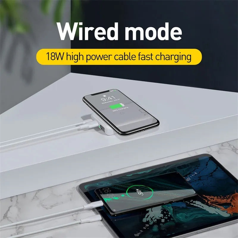 Small square black wireless fast charge power bank with LED digital display showing battery percentage