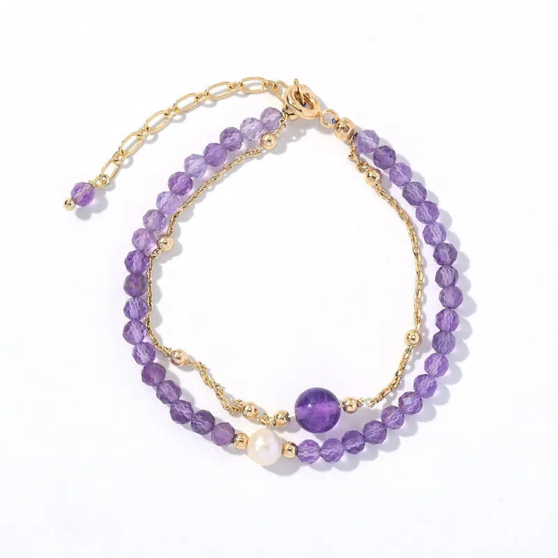 Amethyst crystal bracelet with diamond-shaped stones, adjustable chain, and Chinese-style clasp on wrist