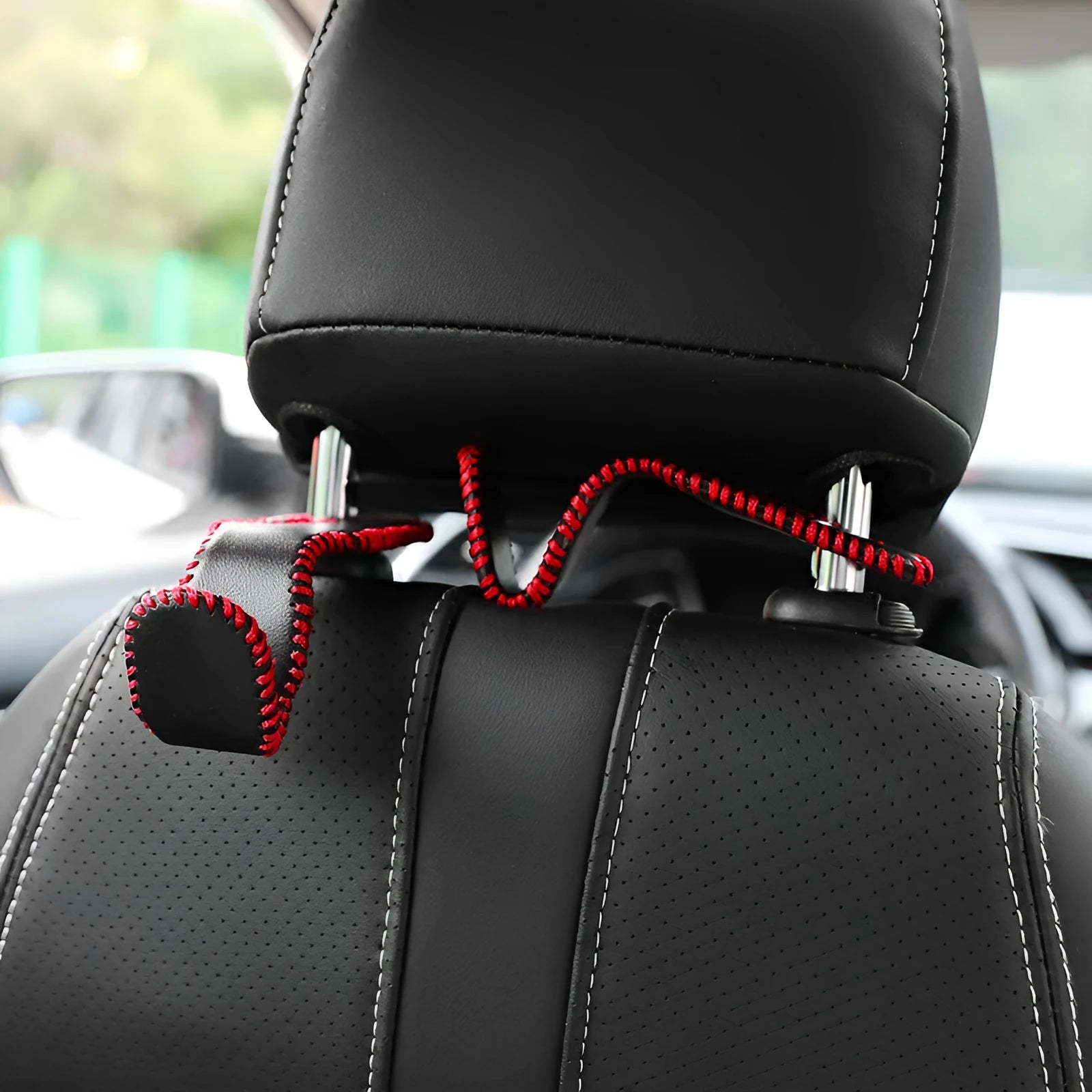 Gold-coloured stainless steel car seat back hook for organising bags on vehicle headrests.