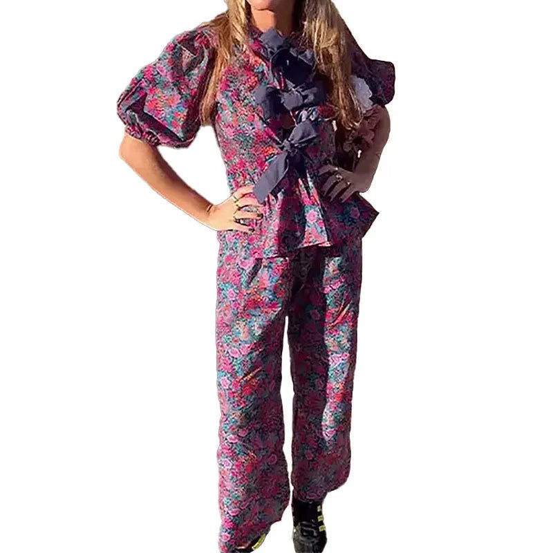 Floral print trousers suit with puff sleeves on top and matching trousers, shown in picture colour