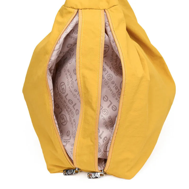 Heart-shaped nylon underarm bag for women in black, blue, khaki, or yellow, showing large capacity and soft design