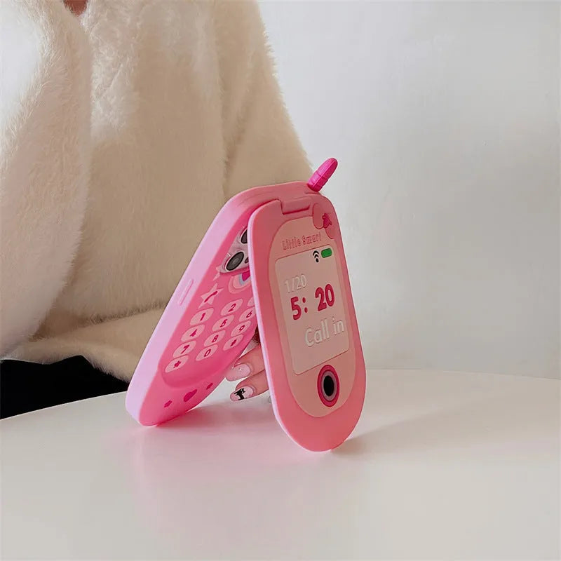 Flip phone shape mirror case for iPhone with silicone construction in light pink colour showing integrated mirror and flip cover design