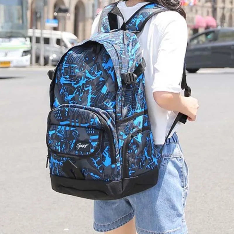 Blue classic nylon backpack with front zipped pocket, showing adjustable padded shoulder straps and 30-litre capacity
