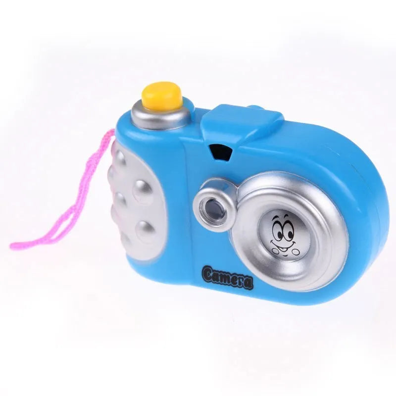Blue or pink kids plastic projection camera toy with sliding lip, showing dinosaur and dolphin images.