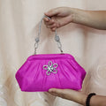 Women's black shoulder messenger bag with document compartment, soft polyester material, and chain decorative details