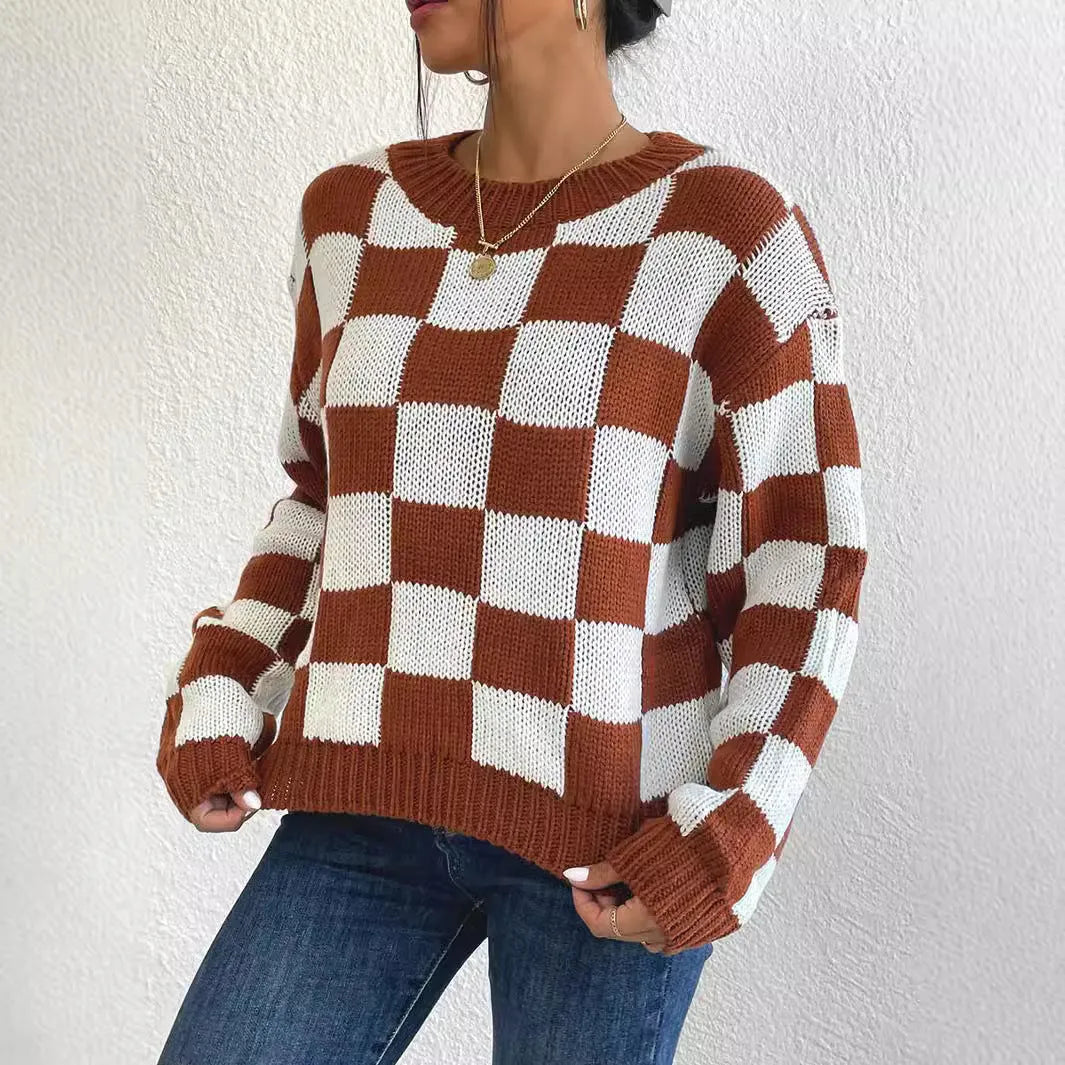 Dark brown plaid pattern pullover sweater with long sleeves and round neck, laid flat showing full design