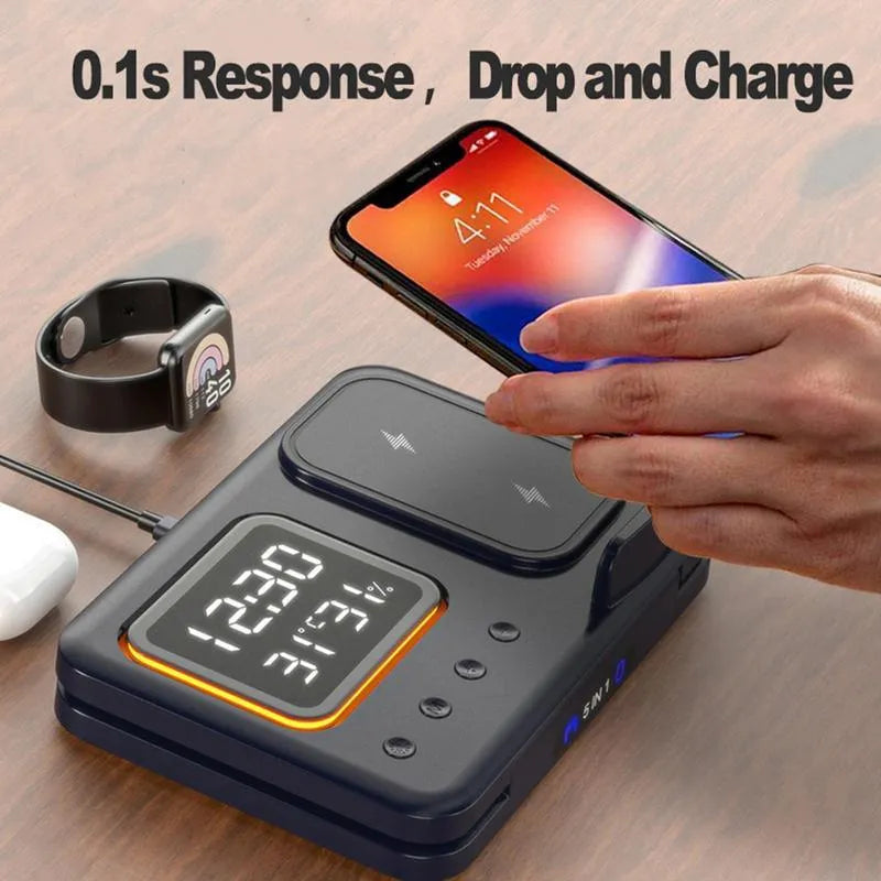 Black and white wireless charging stand with digital clock displaying time and temperature, charging a phone and smartwatch.