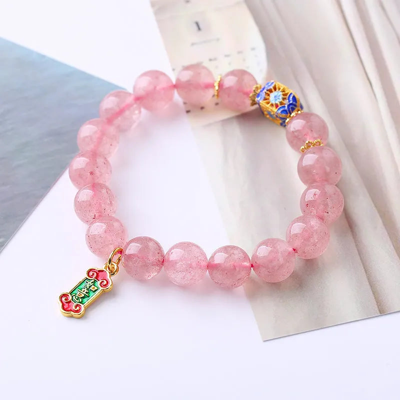 Pink strawberry quartz crystal bracelet with Chinese Ruyi symbols and hand-woven beaded design for women
