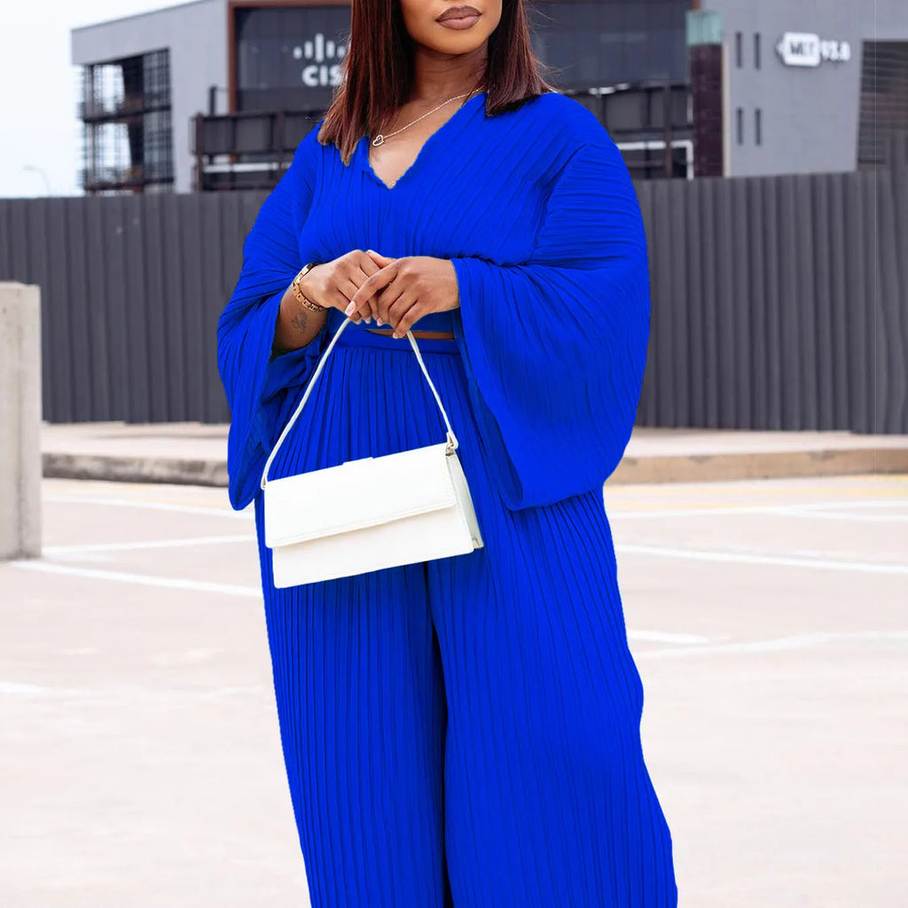 African suit two-piece set featuring a batwing sleeve top and wide-leg trousers in red or sapphire blue.