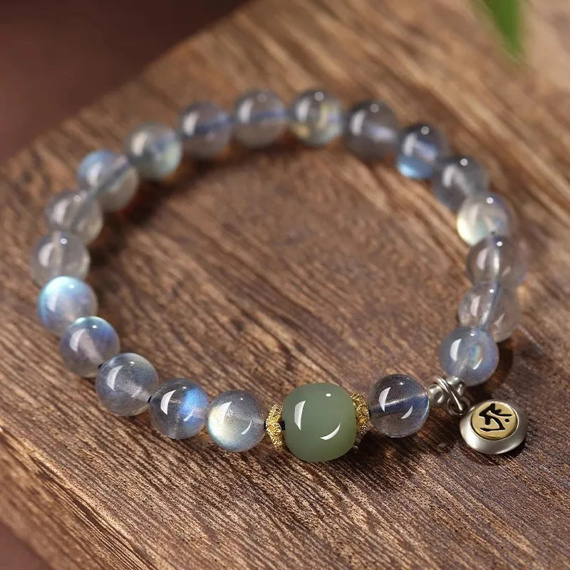 Women's bracelet with 8mm moonstone bead and electroplated Thousand-Hand Kwan-yin mouse charm.