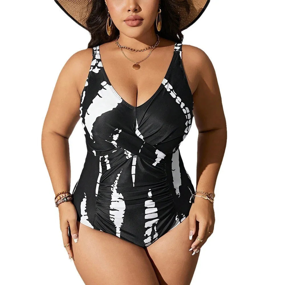 Black plus size one-piece swimsuit on a hanger, showing sleeveless conservative design.