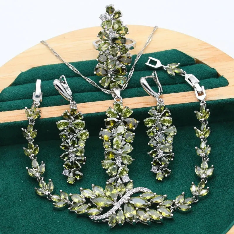 Retro jewellery set with botanical patterns in olive or purple, showing bracelet, necklace, earrings, and ring