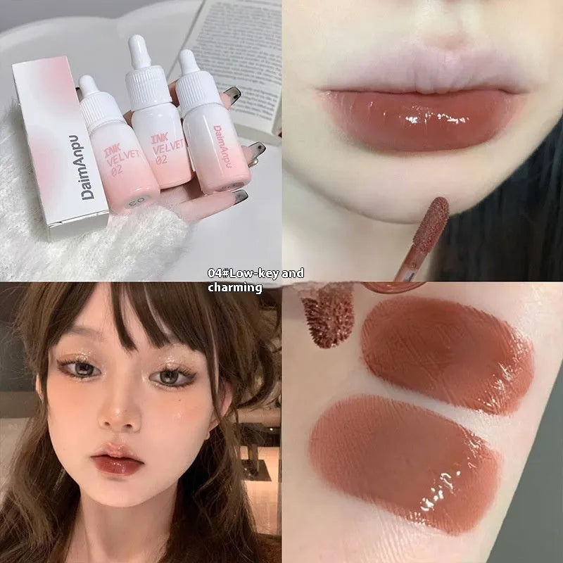 Mirror Lip Lacquer moisturising lip gloss tube in sheer shades on a plain background.