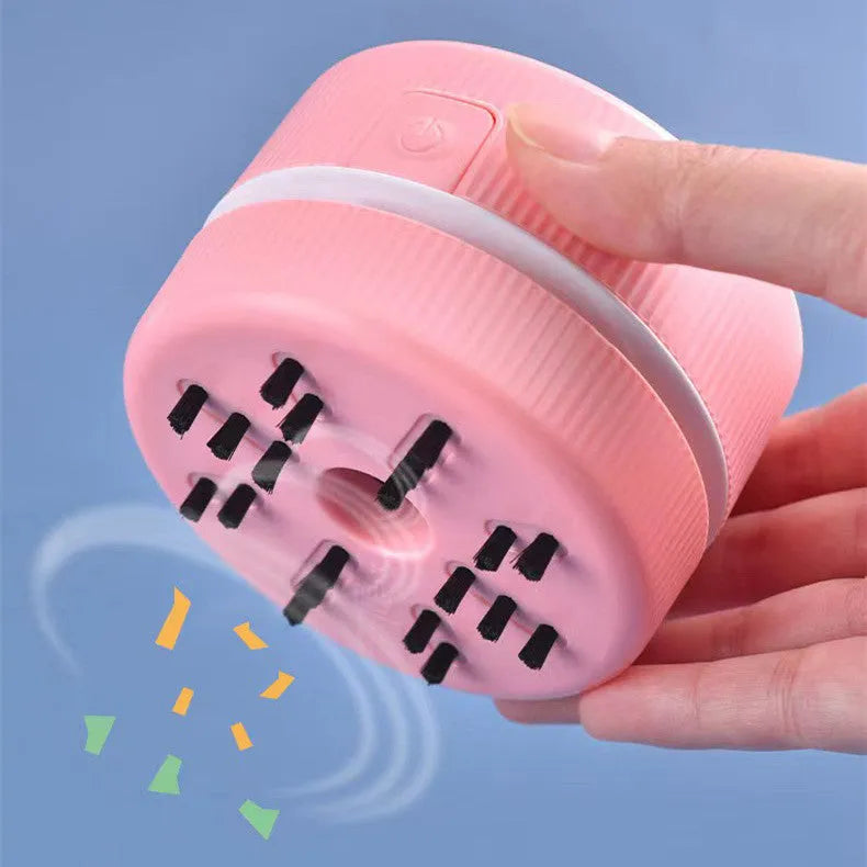 Portable mini desktop vacuum cleaner in pink or blue for pencil eraser chip cleaning
