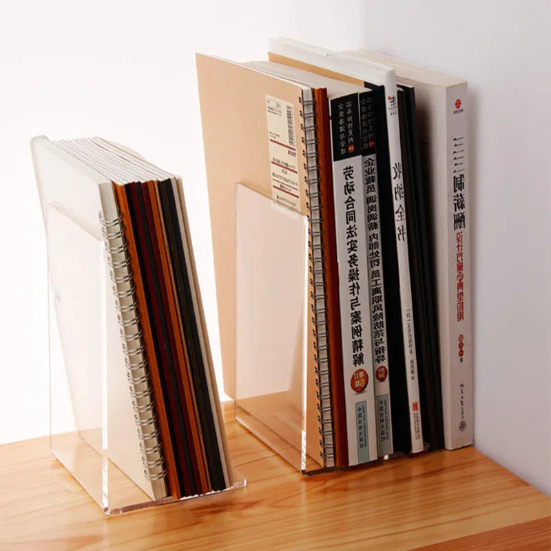 Clear transparent acrylic bookshelf holding a small number of books on a desk