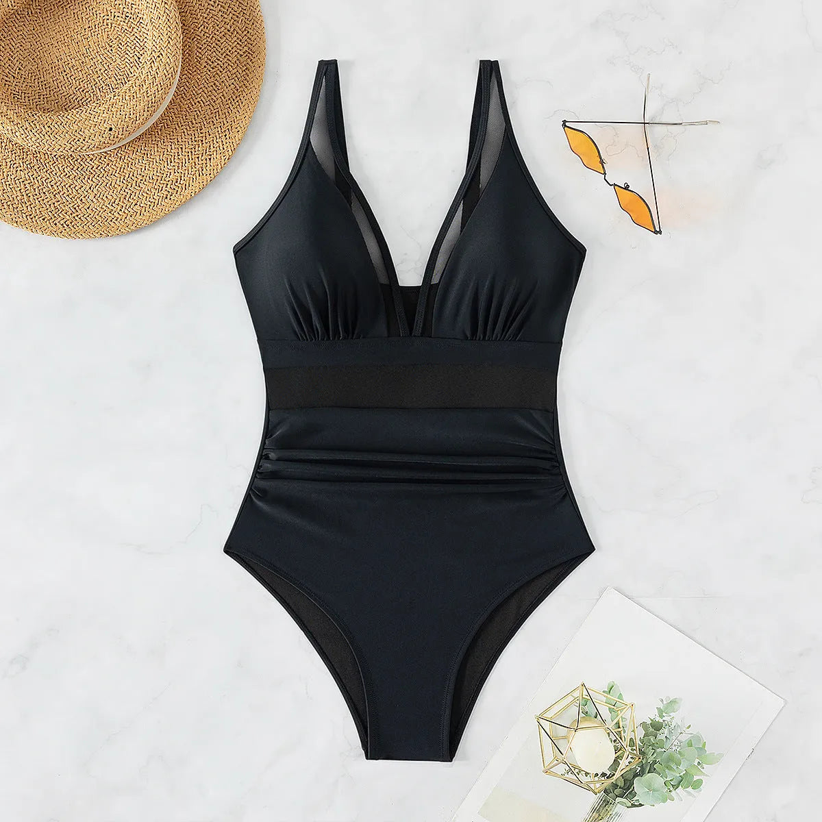 Black women's one-piece swimsuit with a mesh halter neck and brief-style legs.