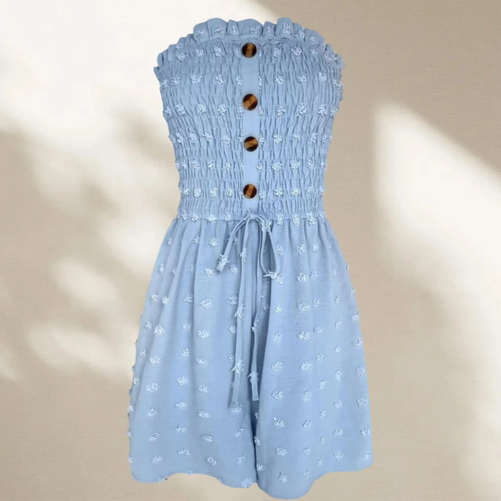 Women's blue off-shoulder sleeveless jumpsuit with button detail and mid-waist design on mannequin