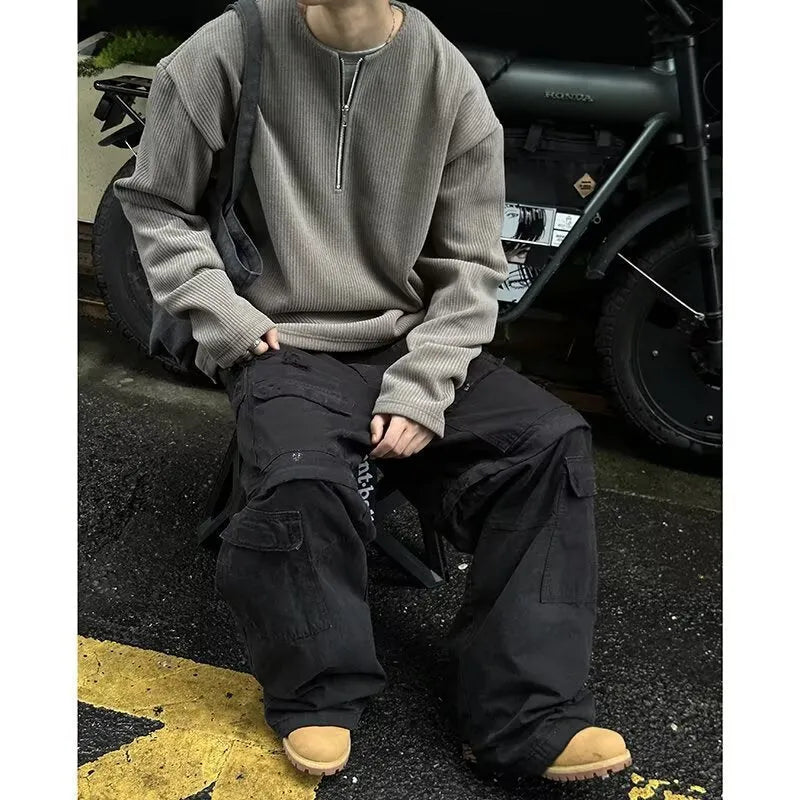 Solid colour loose fit long sleeve pullover top shown in grey, black, or apricot.