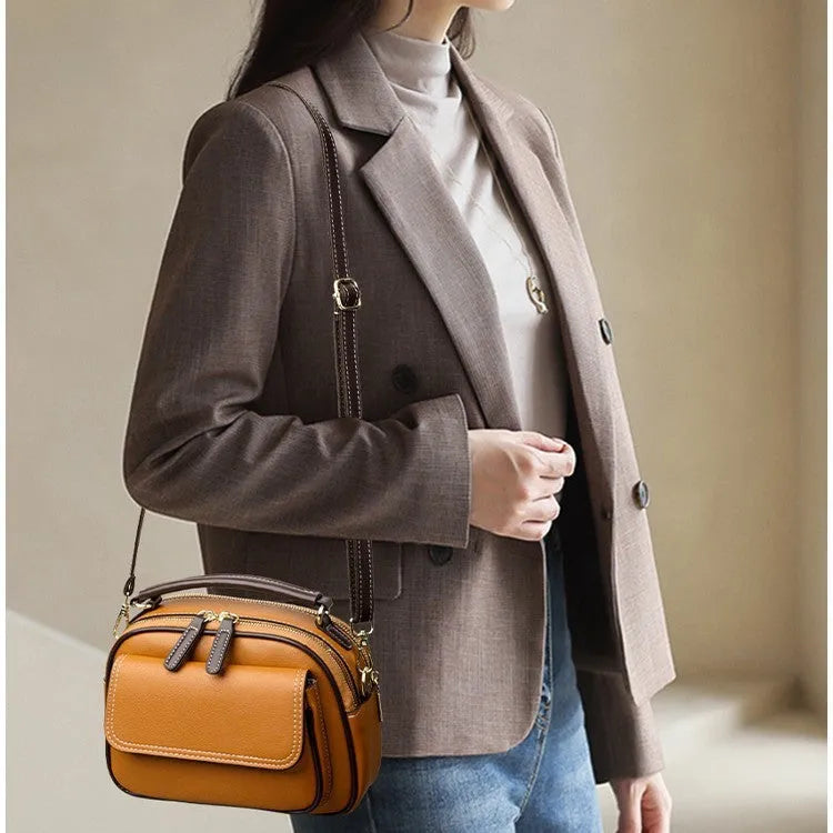 Women's square cross-body shoulder bag in black, green, or orange with double shoulder straps