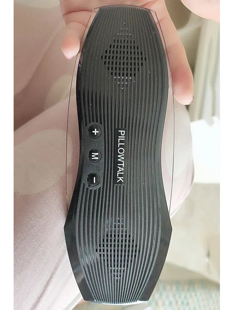 Black wireless in-ear headphones with USB charging port, designed for comfortable sleeping.