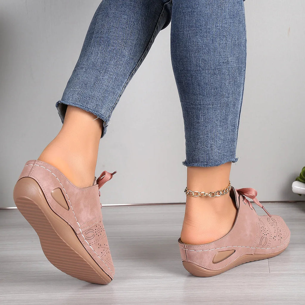 Women's Baotou lace-up slippers with hollow-out wedges in suede upper and rubber sole.