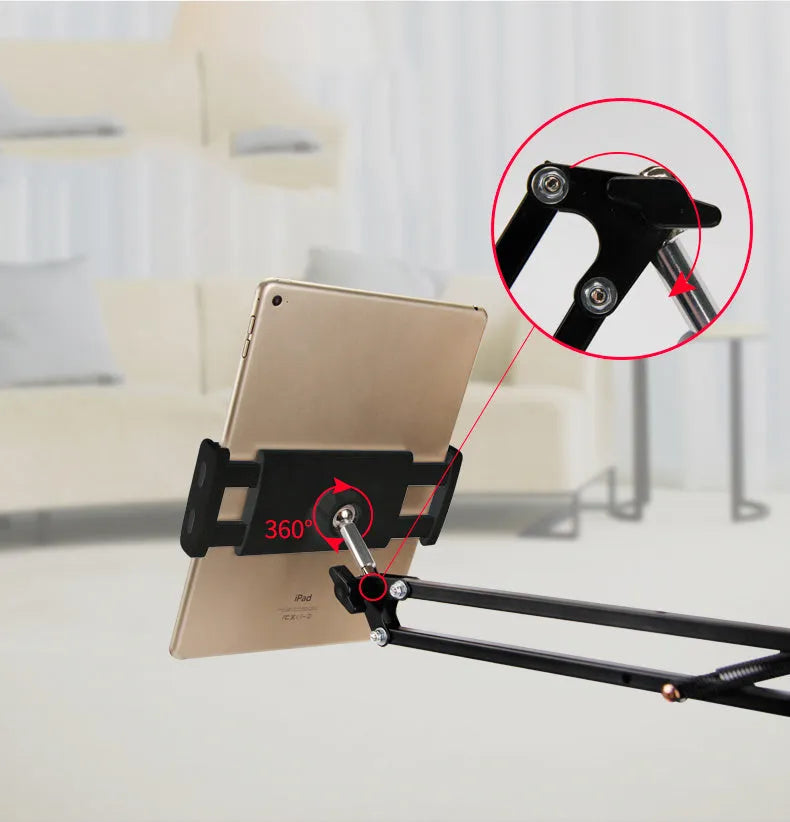 Black adjustable phone and tablet stand on a desk, measuring 10cm in height.