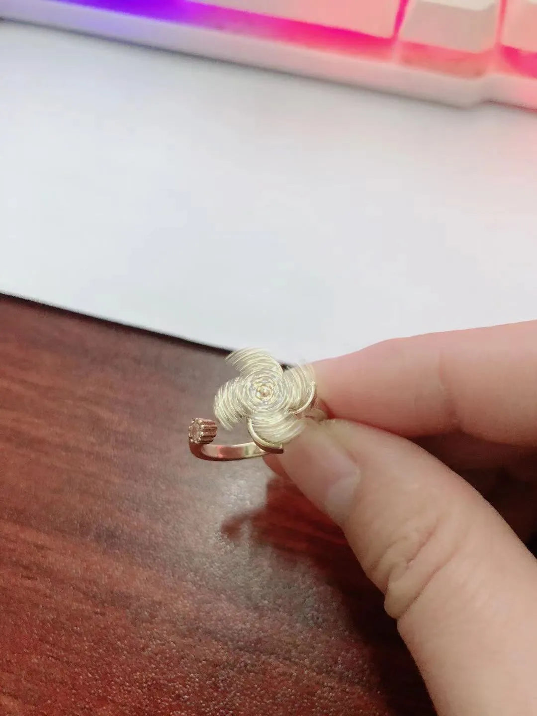 Micro inlaid rotating ring with spinning windmill design in gold or silver electroplated finish on copper