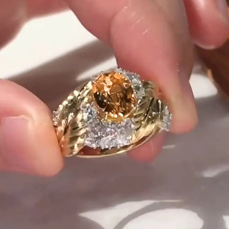 Gold-colour copper embossed feather ring with inlaid yellow zircon, shown in UK size 8