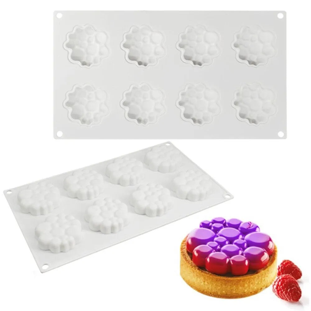Round silicone cake mould with 8 bubble tower pattern design on a kitchen worktop.