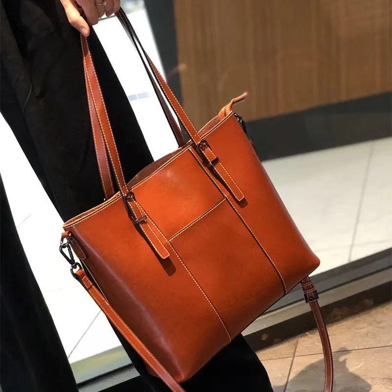 Brown genuine leather women's retro shoulder bag with three strap options and organised interior compartments