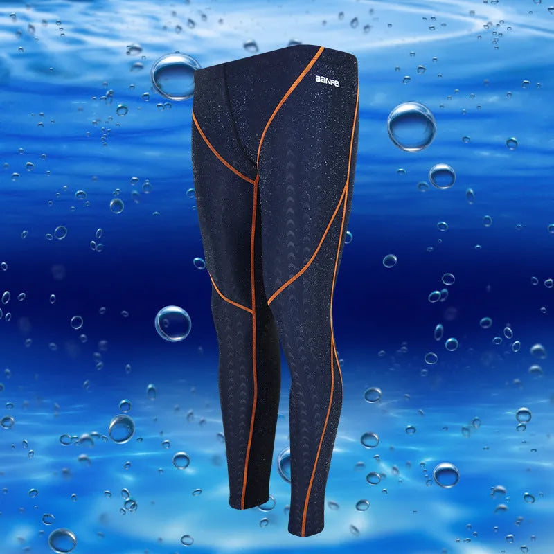 Men's black and green line nylon cropped swimming trunks on a white background.