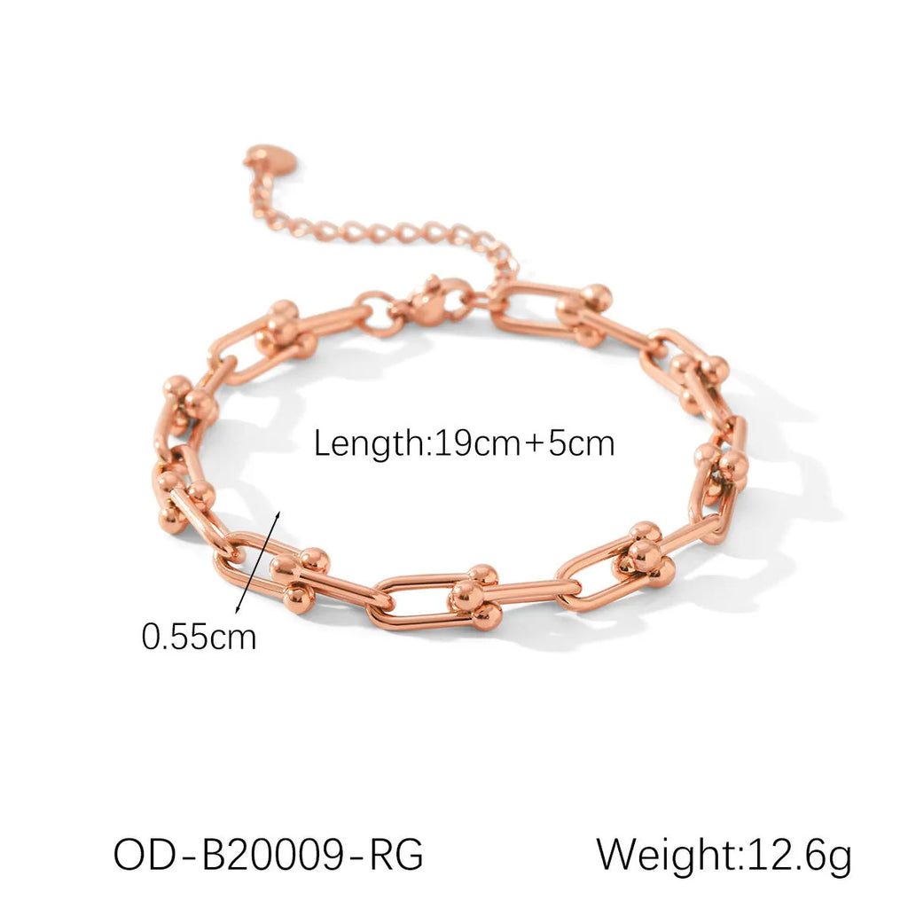 Stainless steel horseshoe jewellery set with necklace, bracelet, and matching earrings