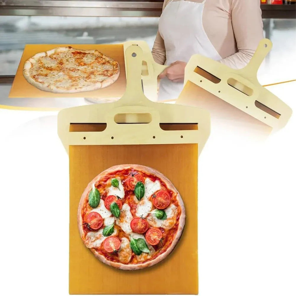 White plastic pizza transfer shovel with handle and hanging hole on a kitchen counter.
