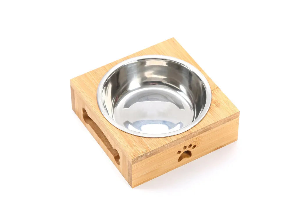 Solid wood pet dining table with stainless steel bowl inserts in a pine finish for dogs and cats.