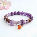 Adjustable nine purple amethyst and red agate Mori-style crystal bracelet showing 8mm beads and organic stone arrangement