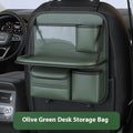 Black leather car seat storage bag with a foldable dining table deployed, hanging behind a car headrest