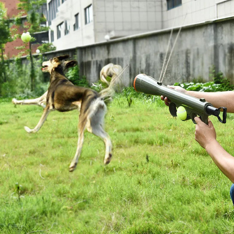 Black ABS plastic dog tennis ball launcher with two tennis balls for long-range throwing