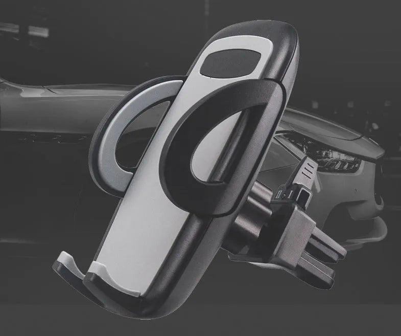 Black plastic mobile phone holder attached to car air conditioning vent with phone secured