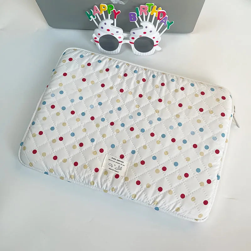 Women's polka dot polyester laptop bag shown in three sizes for 11-inch, 13-inch, and 15-inch laptops.